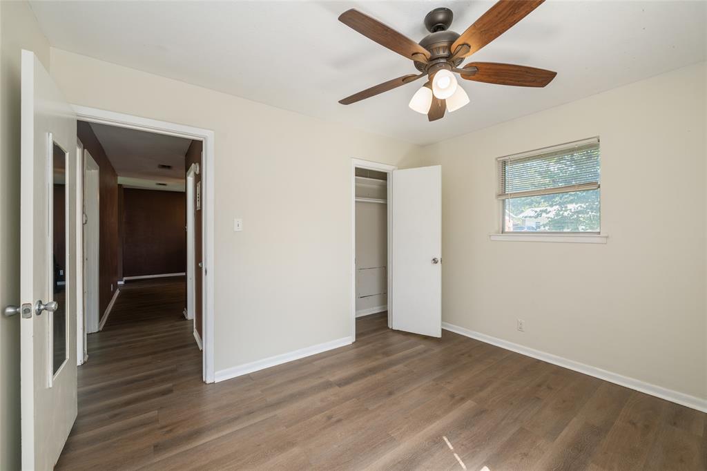 604 Pershing Drive Denton, TX 76209 - Photo 14 of 24 wooden floor in an empty room with a window