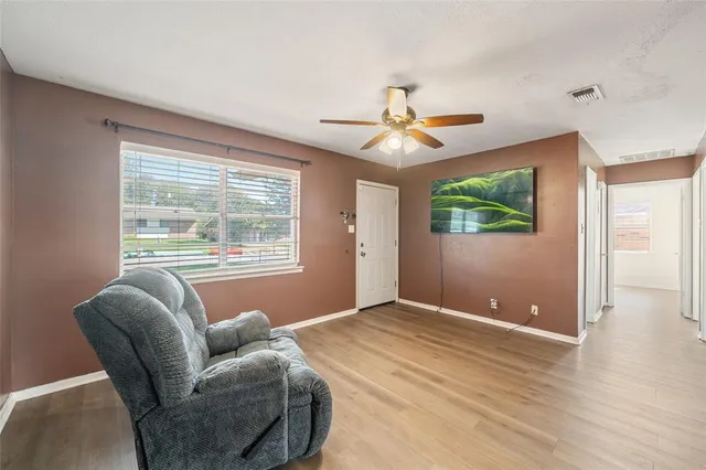 a living room with furniture and a window