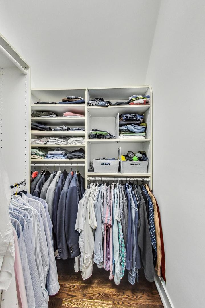 929 Valley Road Glencoe, IL 60022 - Photo 20 of 46 a view of walk in closet with clothes and shoes