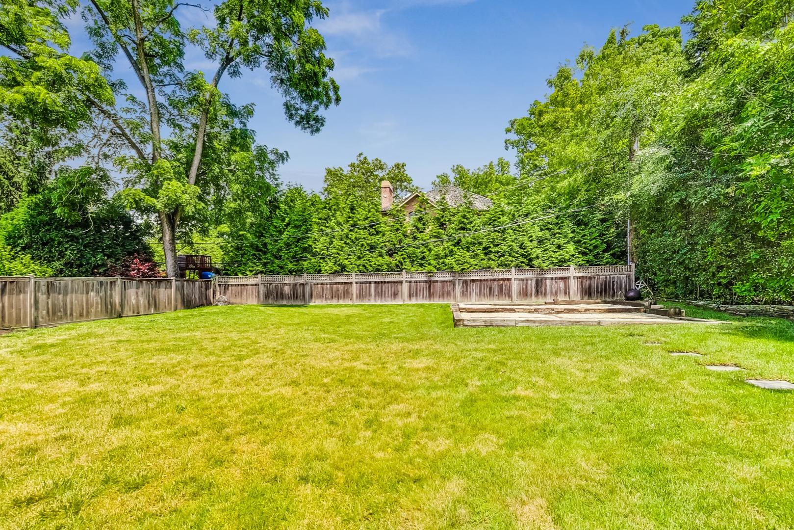 929 Valley Road Glencoe, IL 60022 - Photo 44 of 46 a view of a swimming pool with a yard