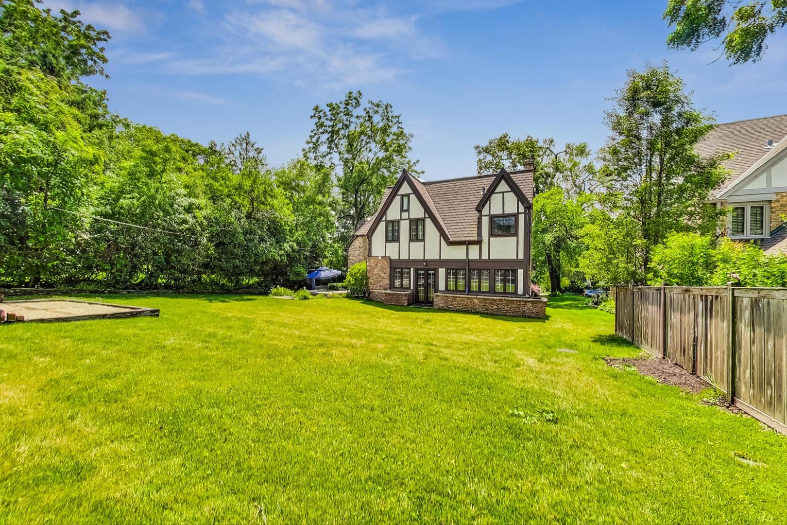 929 Valley Road Glencoe, IL 60022 - Photo 45 of 46 a house with swimming pool in front of it