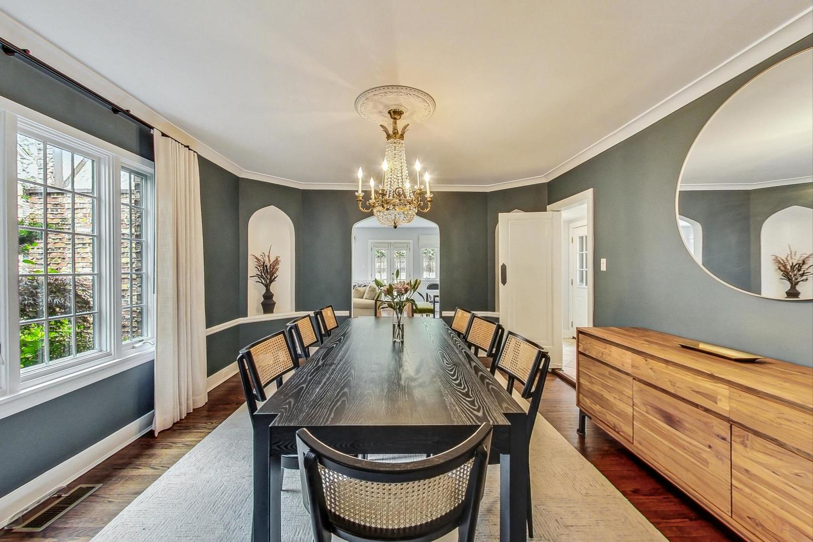 929 Valley Road Glencoe, IL 60022 - Photo 8 of 46 a view of a dining room with furniture and a chandelier