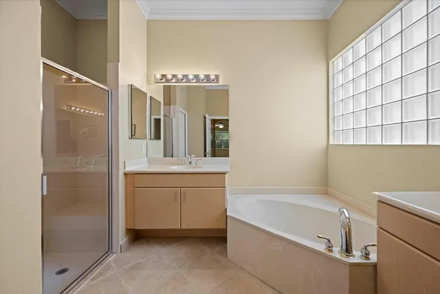 a bathroom with a bathtub sink and mirror