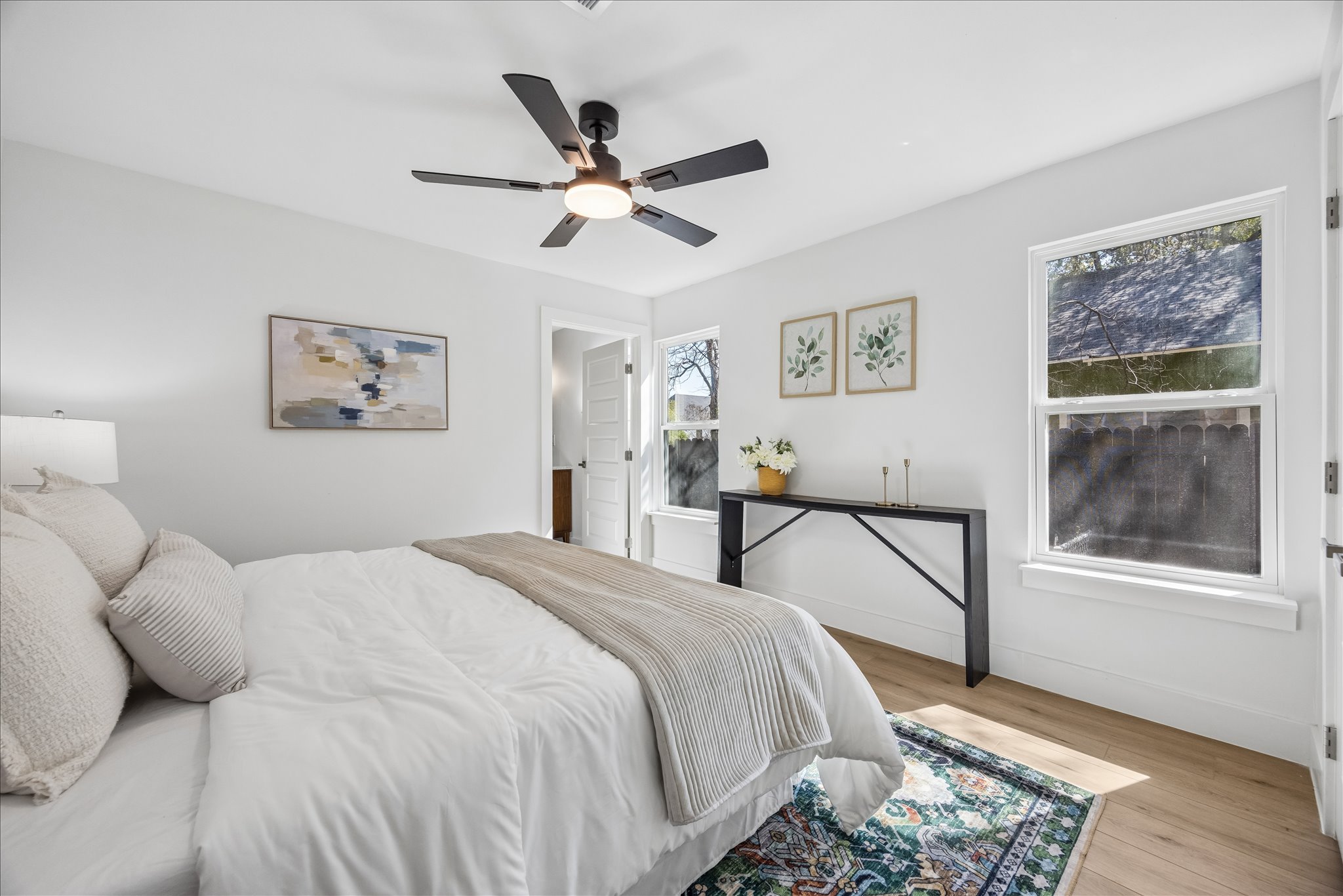 808 West Elizabeth Street Austin, TX 78704 - Photo 11 of 20 Bedroom featuring wood finished floors and ceiling fan