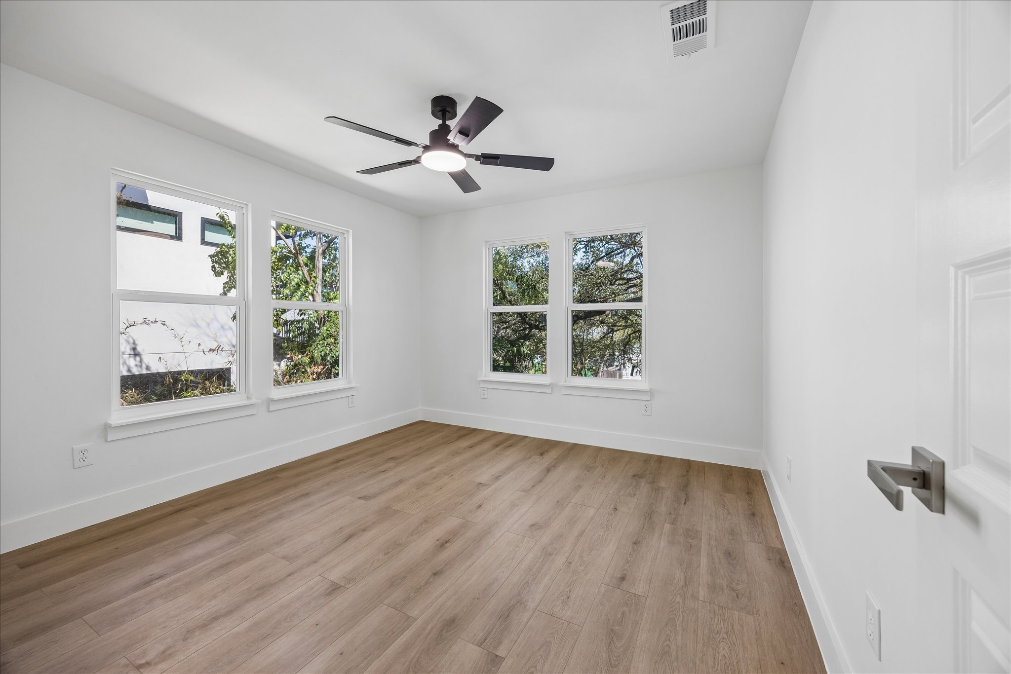 808 West Elizabeth Street Austin, TX 78704 - Photo 15 of 20 Spare room with light wood-style flooring and ceiling fan