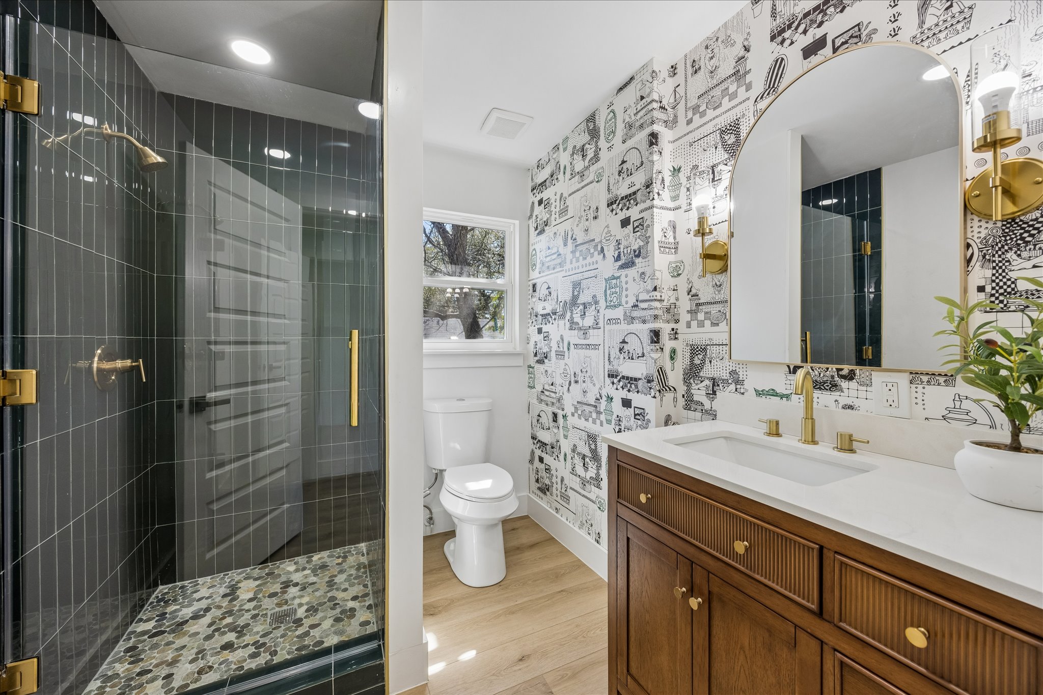 808 West Elizabeth Street Austin, TX 78704 - Photo 18 of 20 Bathroom featuring vanity, a shower stall, light wood finished floors, wallpapered walls, and recessed lighting