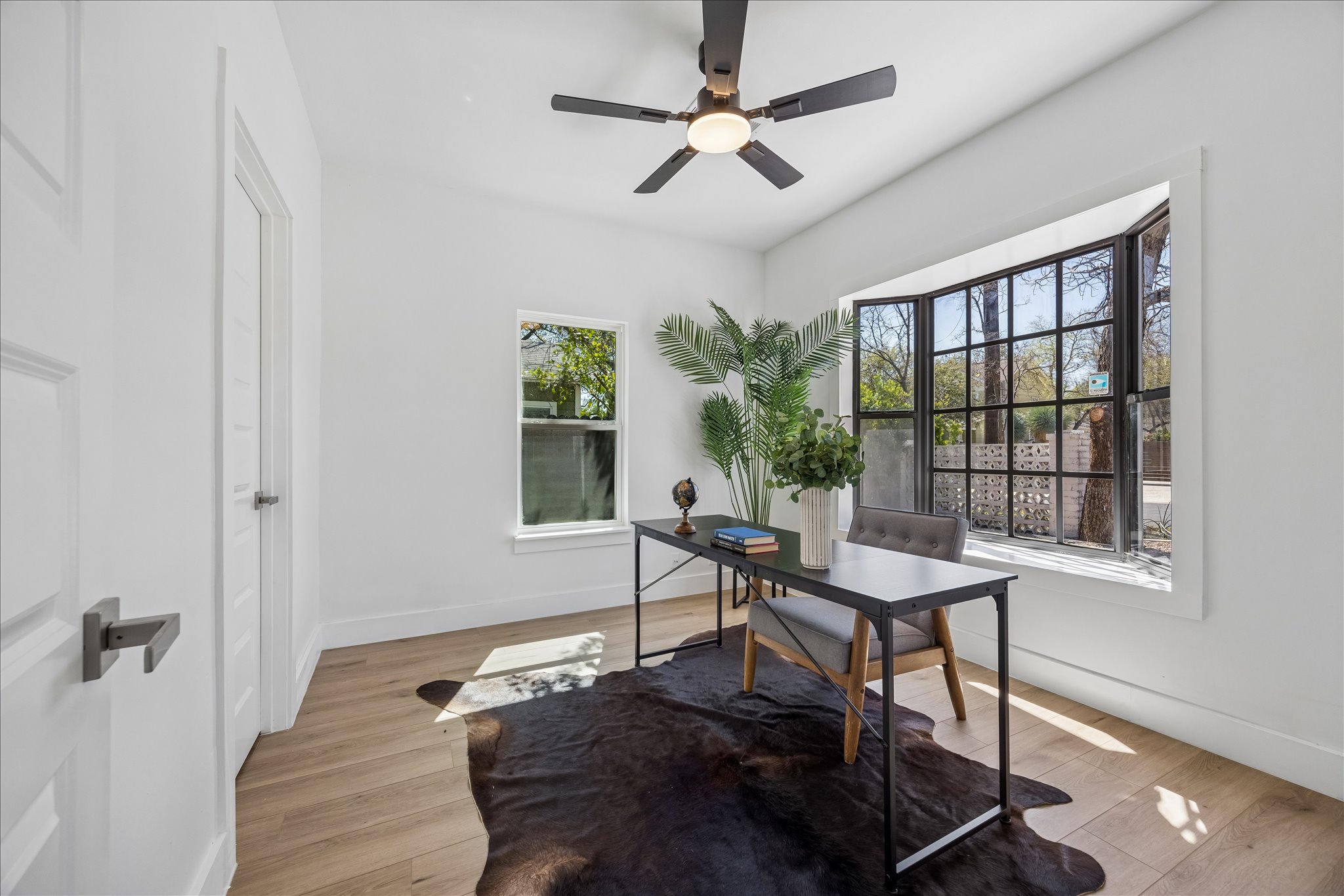 808 West Elizabeth Street Austin, TX 78704 - Photo 3 of 20 Office area featuring a ceiling fan and light wood-style floors