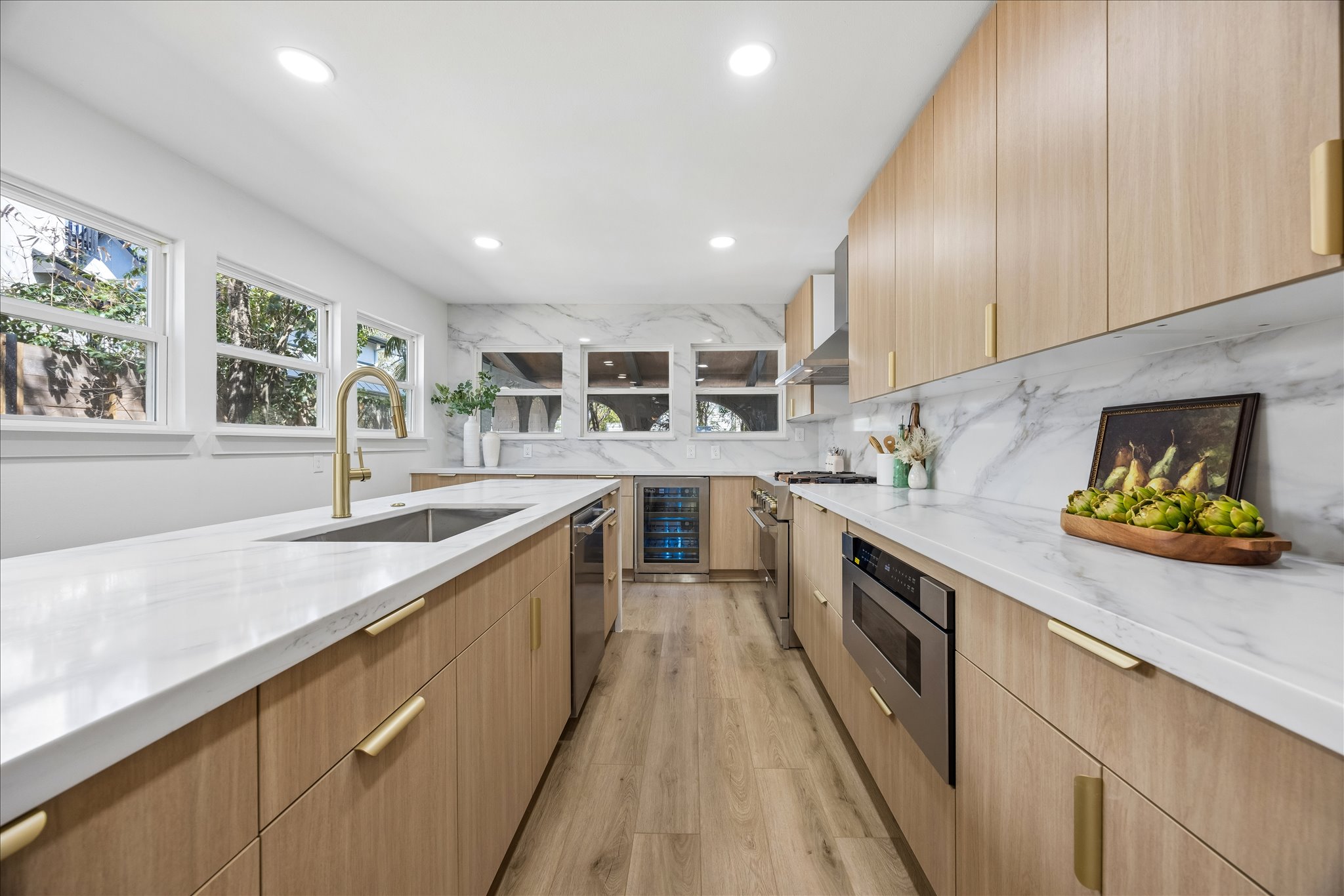 808 West Elizabeth Street Austin, TX 78704 - Photo 10 of 20 Kitchen with light stone countertops, modern cabinets, light wood finish cabinetry, and recessed lighting