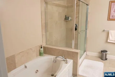 a bathroom with a sink toilet and a mirror