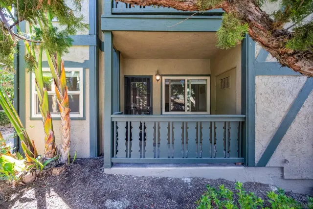 a view of front door and yard