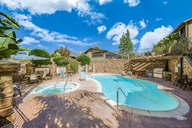 a view of a swimming pool with a patio