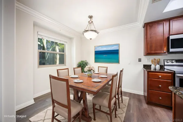 a view of a dining room with furniture window and wooden floor