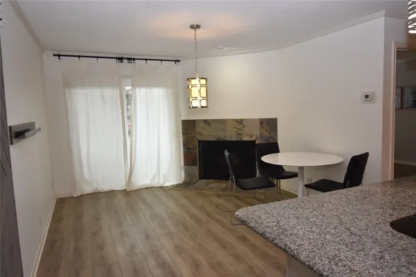 a view of a livingroom with furniture and a fireplace