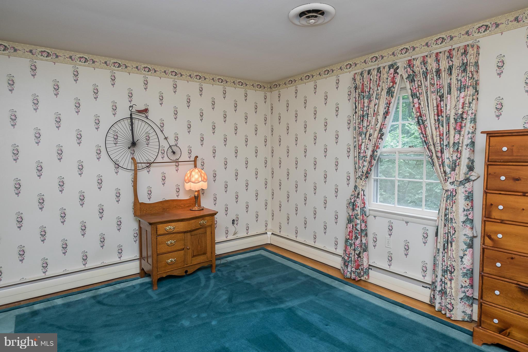 10836 Harding Road Laurel, MD 20723 - Photo 15 of 25 a view of an empty room with wooden floor and a window