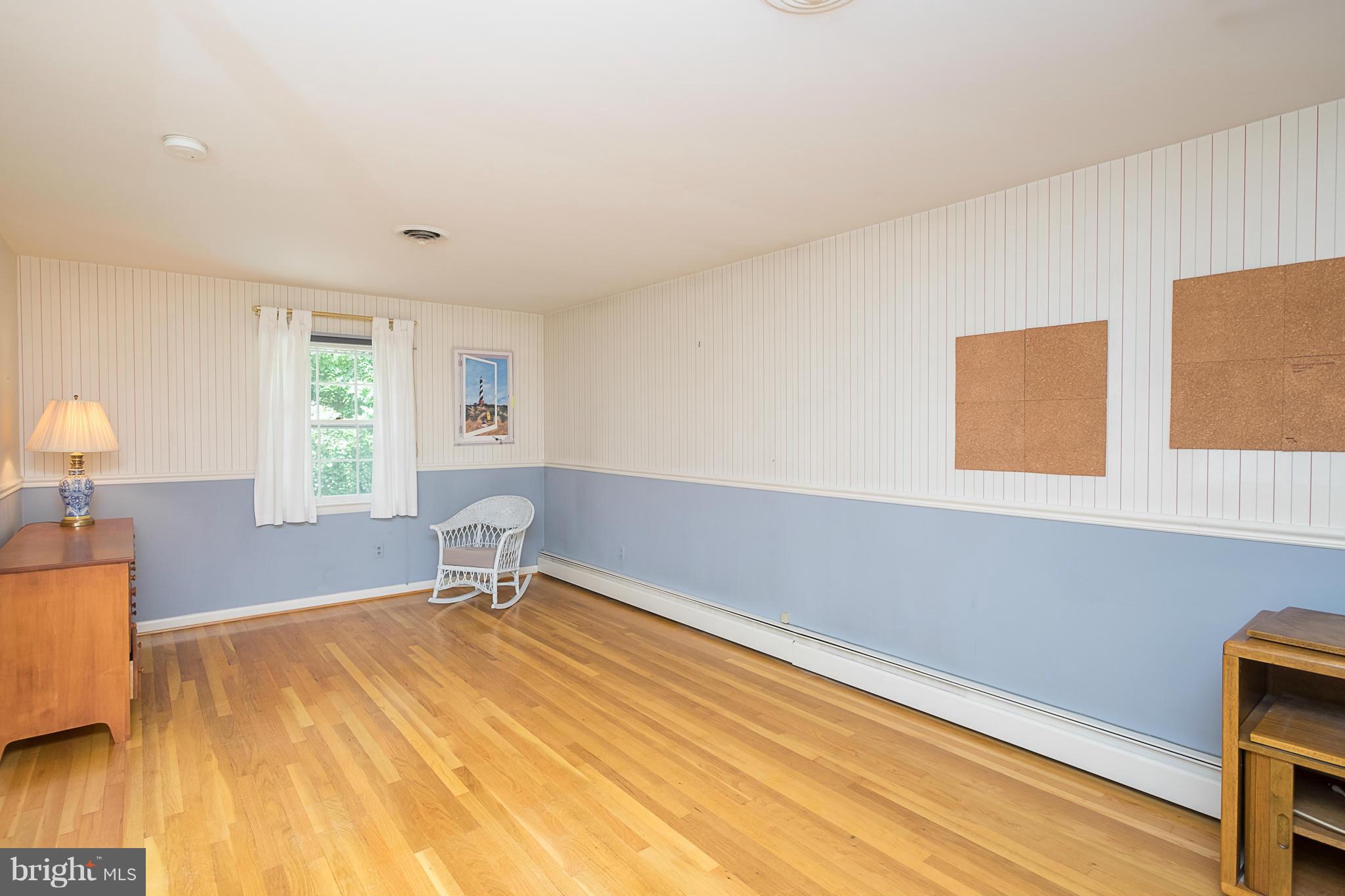 10836 Harding Road Laurel, MD 20723 - Photo 20 of 25 a bedroom with a bed and a window