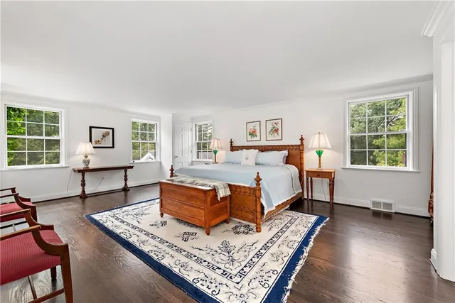 a bedroom with a bed and a table in it