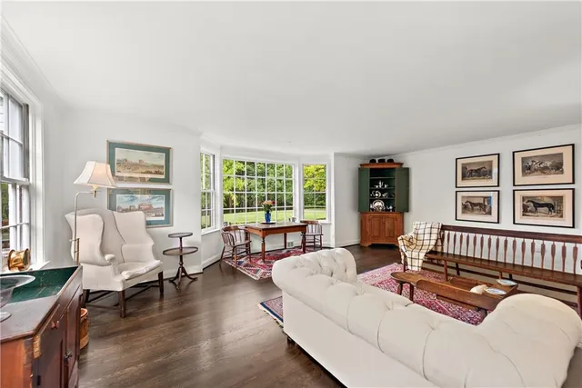 a living room with furniture and windows
