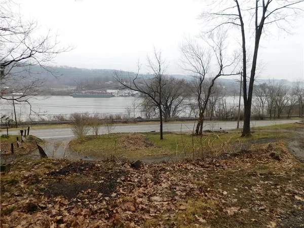 a view of a lake with a yard