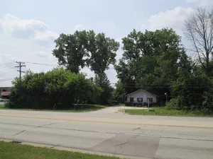 a house with trees in front of it
