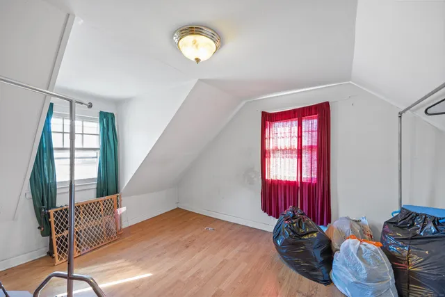 a view of a room with furniture and windows