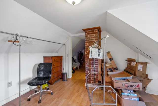 a view of a livingroom with furniture and gym equipment