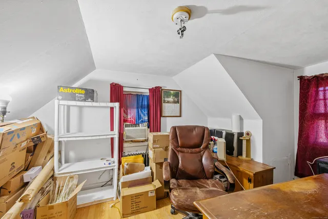 a room with furniture and air hockey table