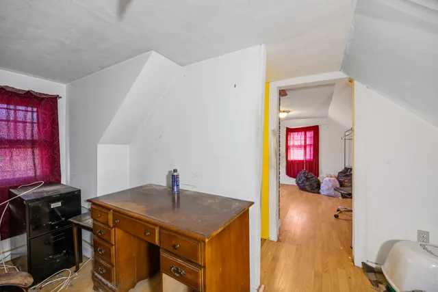 a kitchen that has a microwave and a stove top oven