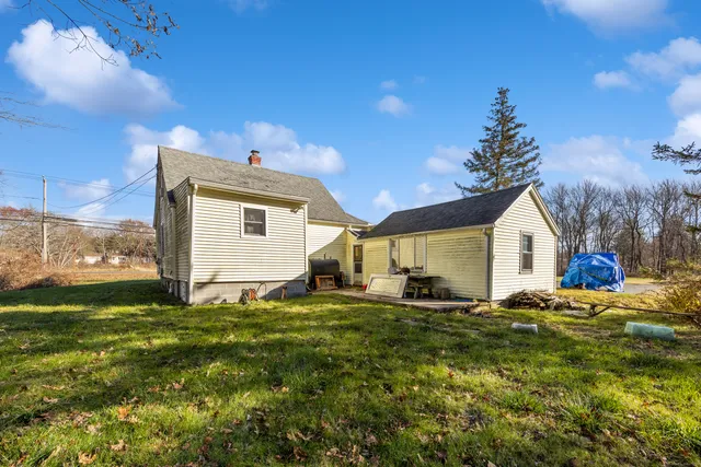 a big house with a big yard and large trees