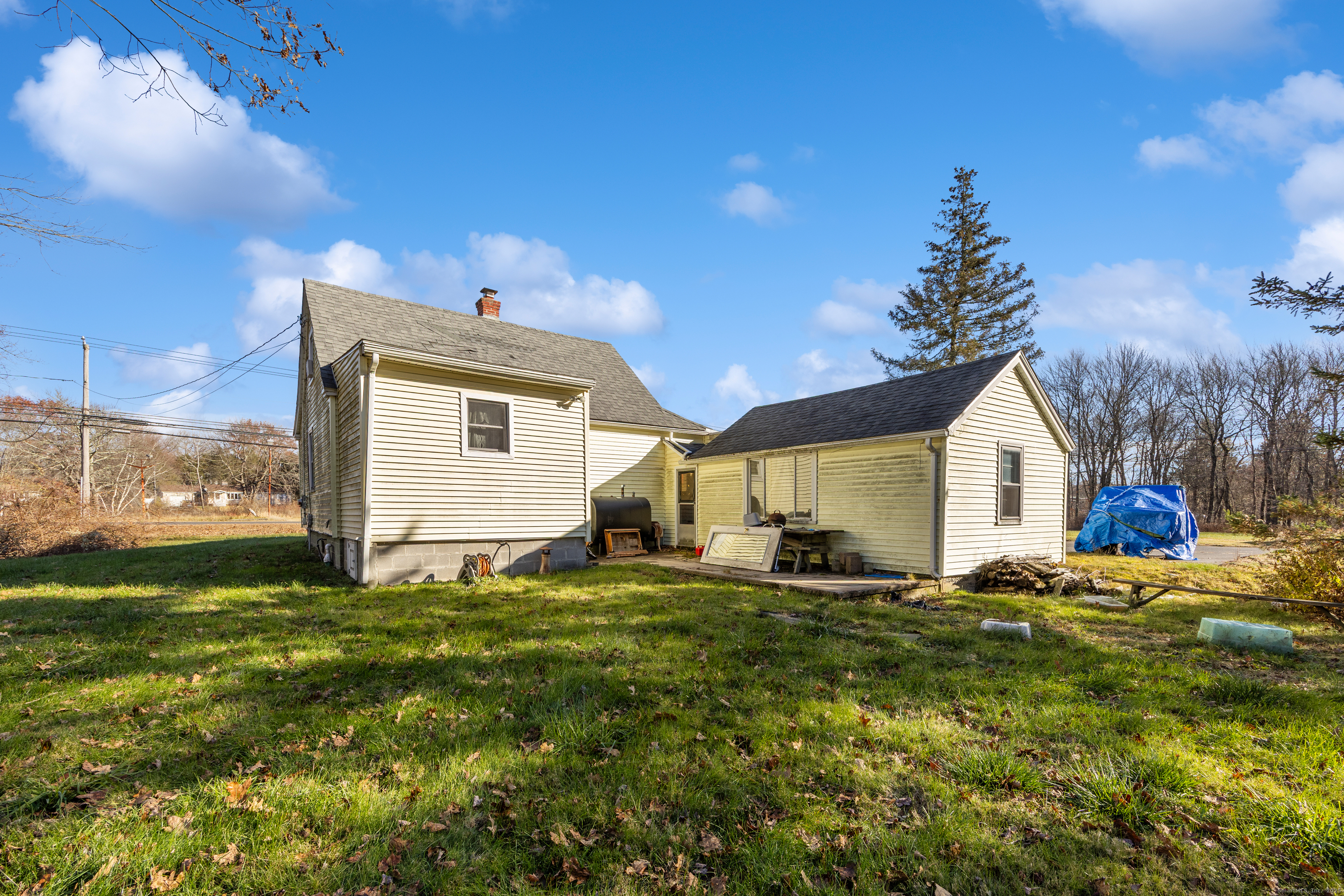 1557 Wolcott Road Wolcott, CT 06716 - Photo 17 of 18 a big house with a big yard and large trees