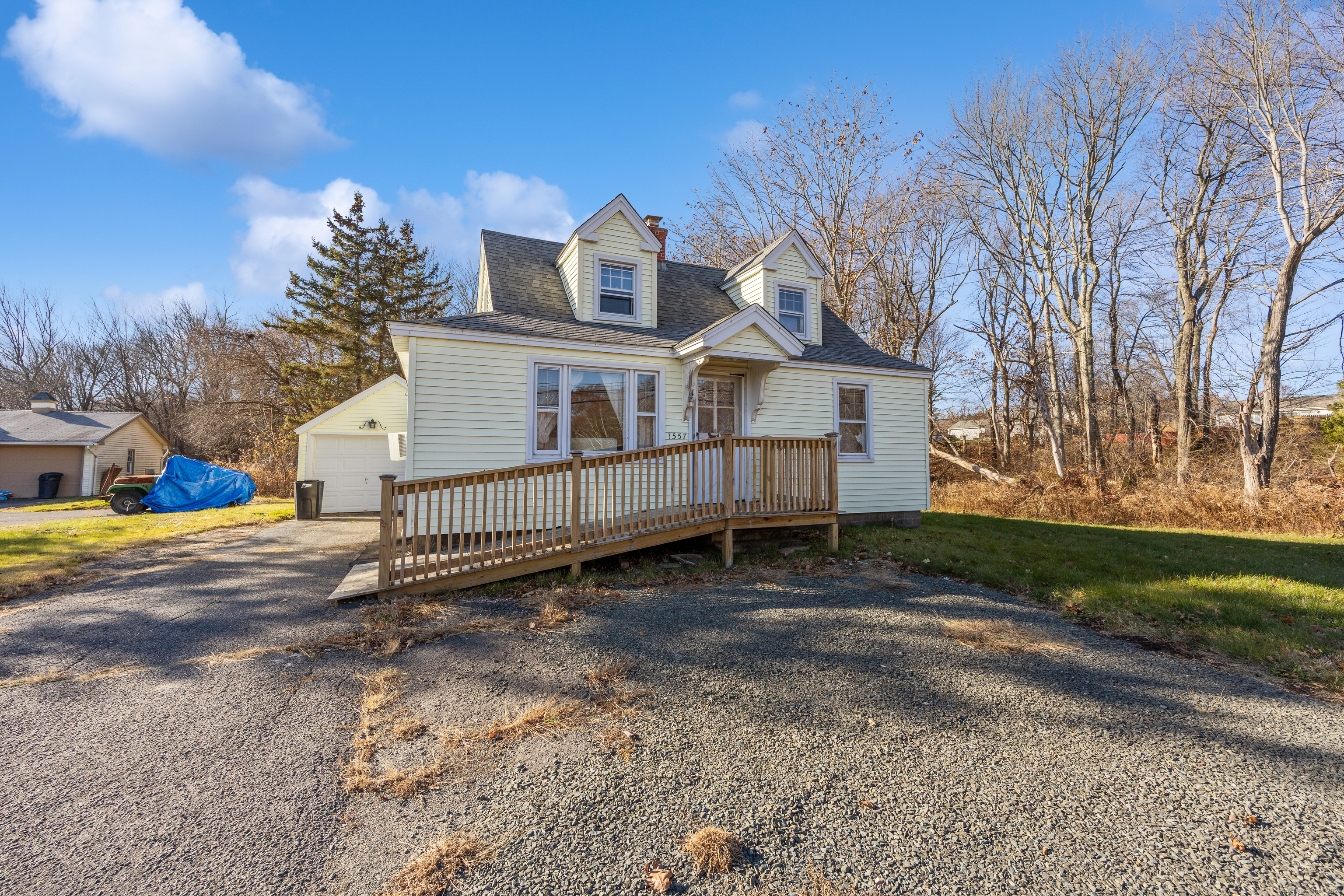 1557 Wolcott Road Wolcott, CT 06716 - Photo 2 of 18 a view of a house with a yard and a large tree