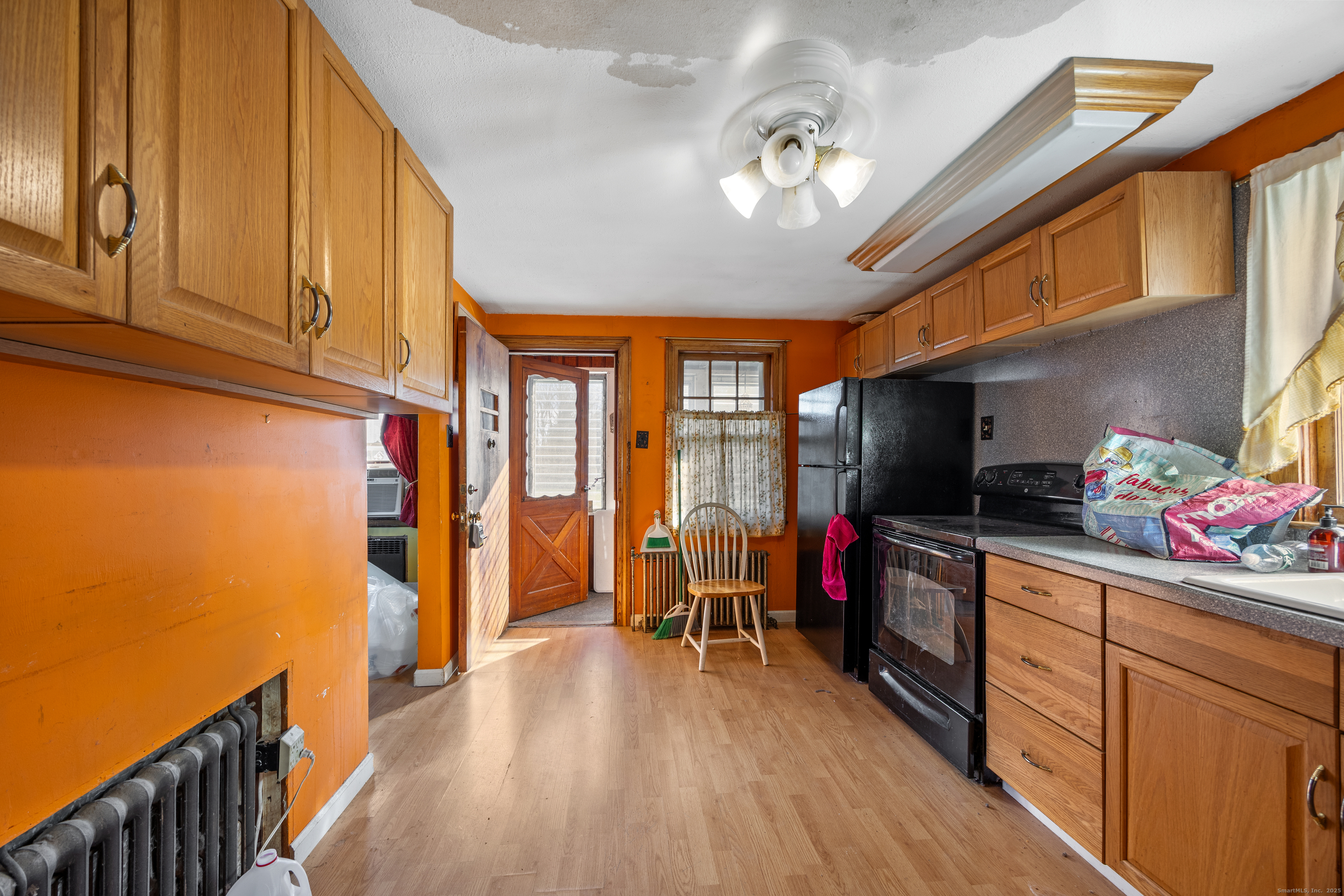 1557 Wolcott Road Wolcott, CT 06716 - Photo 4 of 18 a view of a livingroom with wooden floor and furniture
