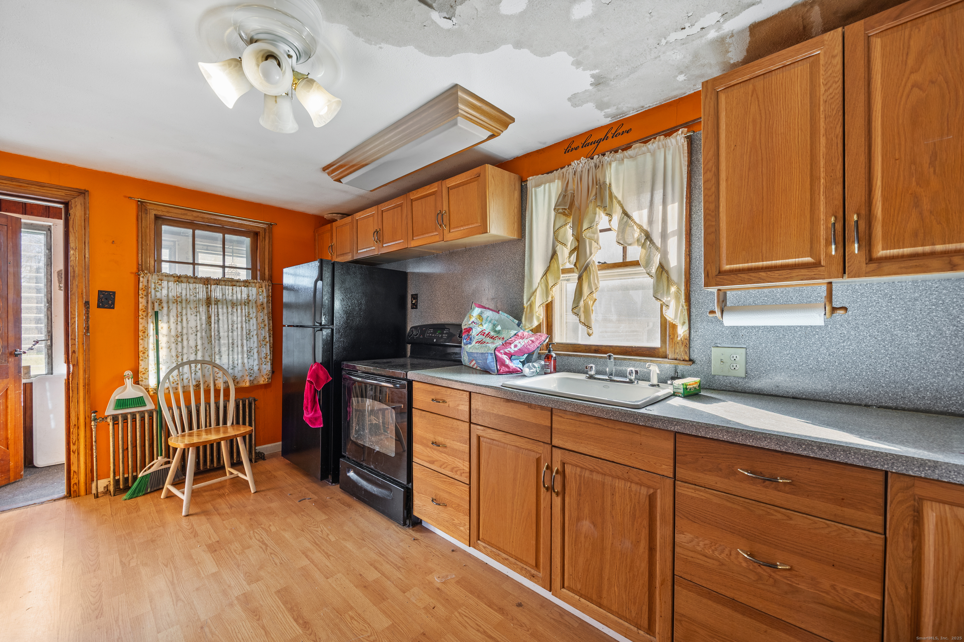 1557 Wolcott Road Wolcott, CT 06716 - Photo 5 of 18 a view of a livingroom with furniture and windows