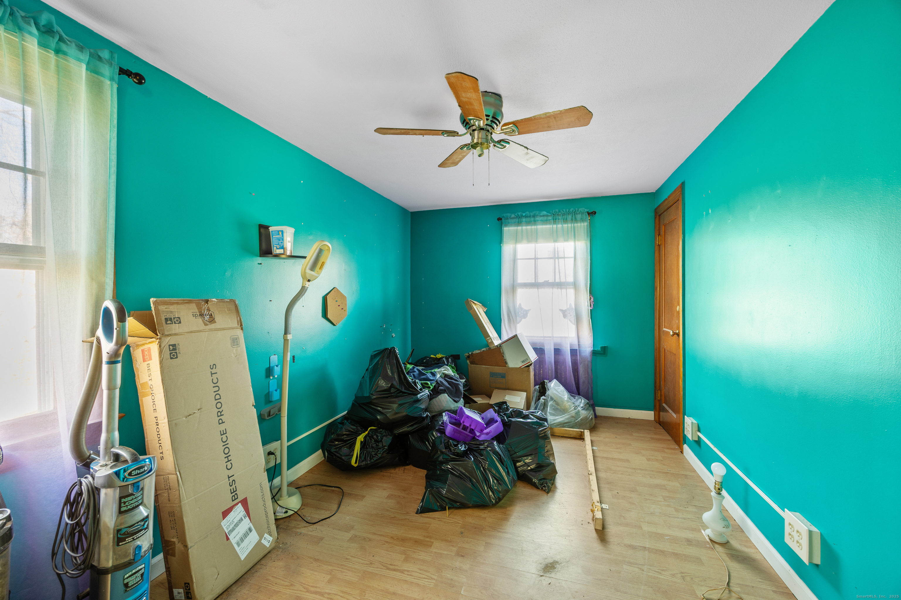 1557 Wolcott Road Wolcott, CT 06716 - Photo 10 of 18 a living room with furniture and a chandelier