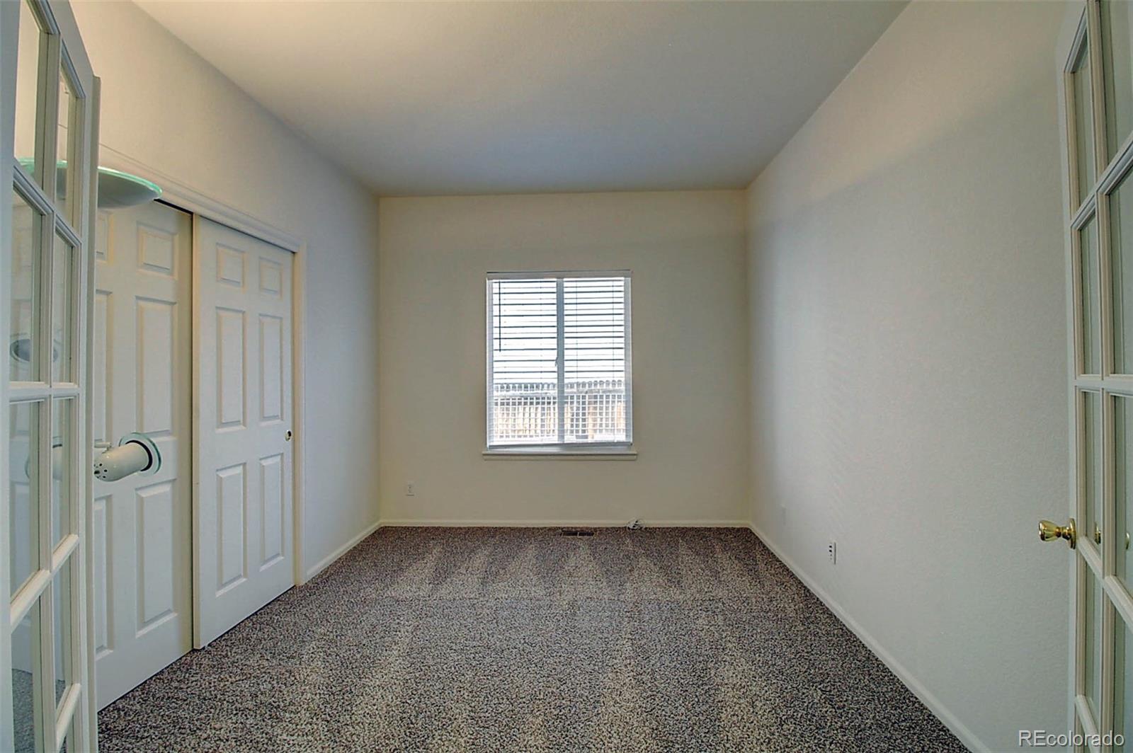 5794 South Rome Street Aurora, CO 80015 - Photo 14 of 37 a view of an empty room with a window