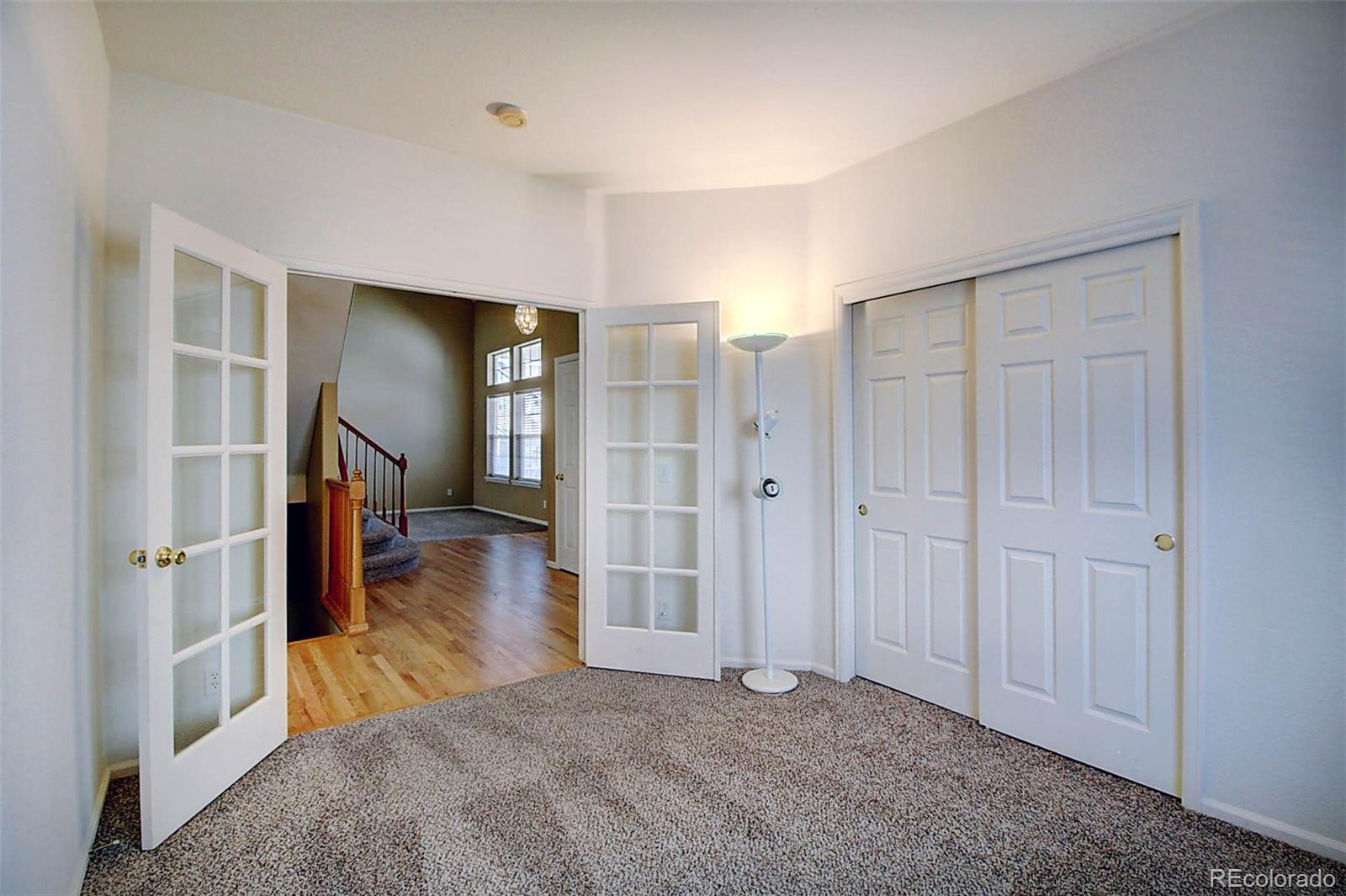 5794 South Rome Street Aurora, CO 80015 - Photo 15 of 37 wooden floor in an empty room
