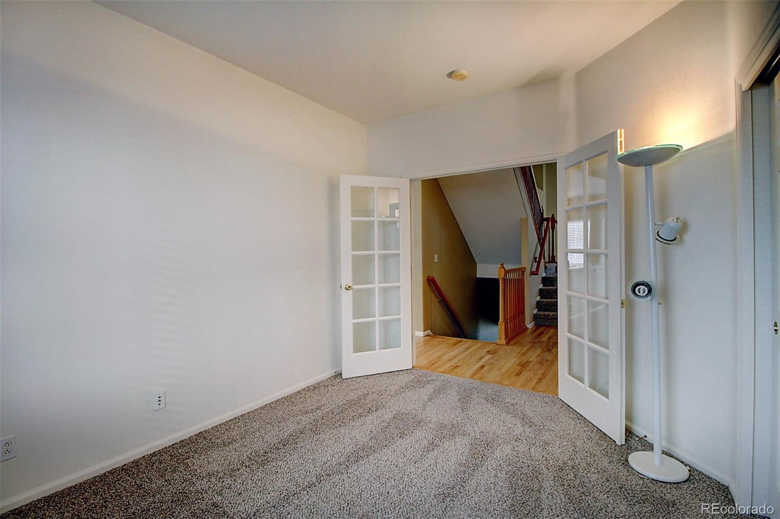 5794 South Rome Street Aurora, CO 80015 - Photo 16 of 37 a view of a big room with closet and mirror