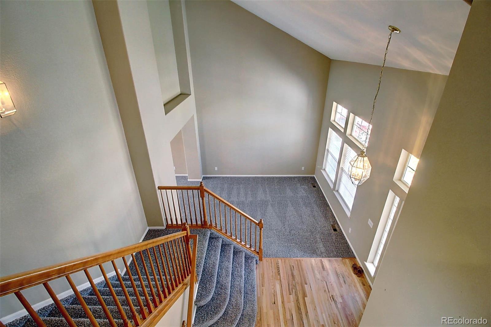 5794 South Rome Street Aurora, CO 80015 - Photo 17 of 37 a view of entryway with wooden floor
