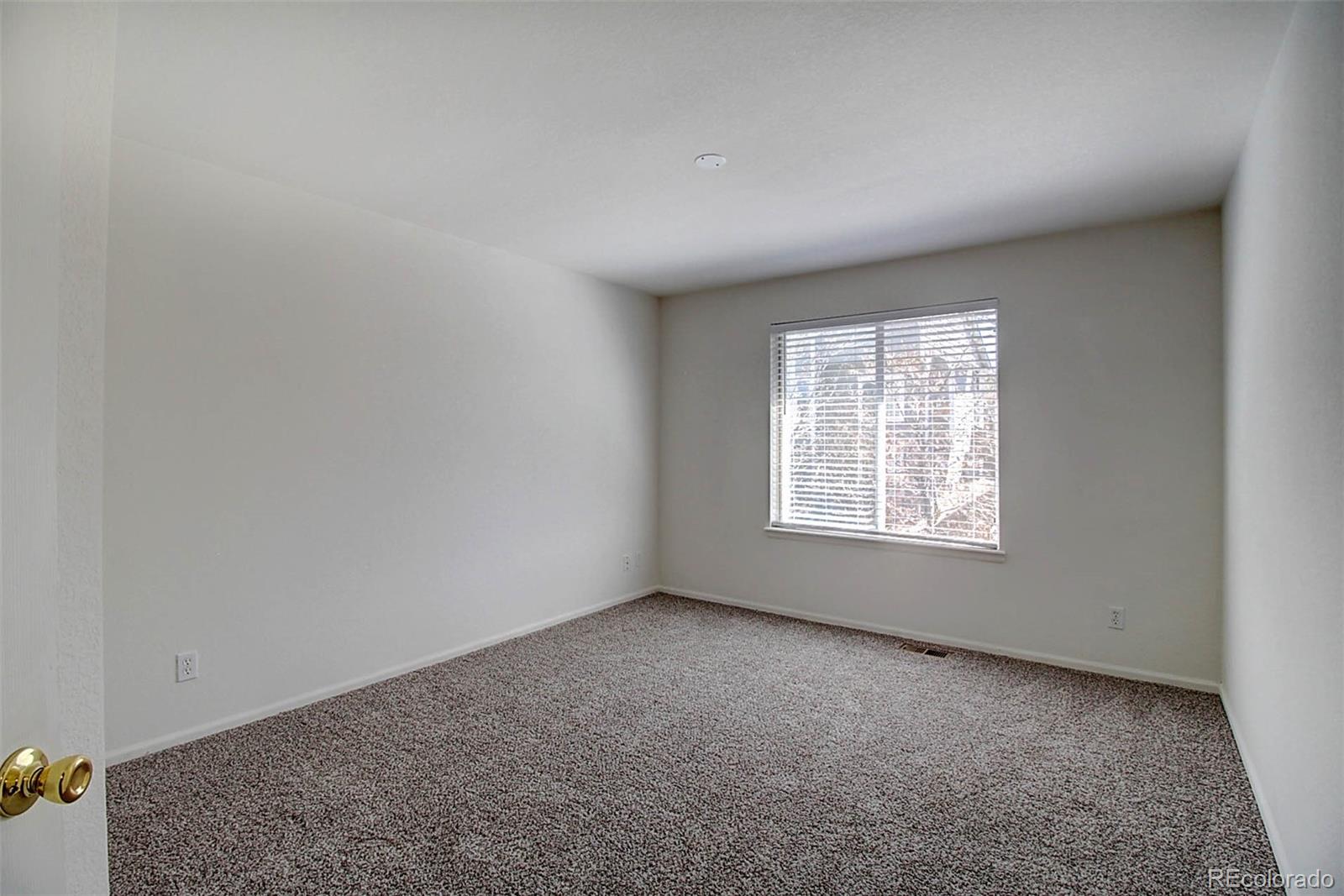 5794 South Rome Street Aurora, CO 80015 - Photo 22 of 37 an empty room with a window