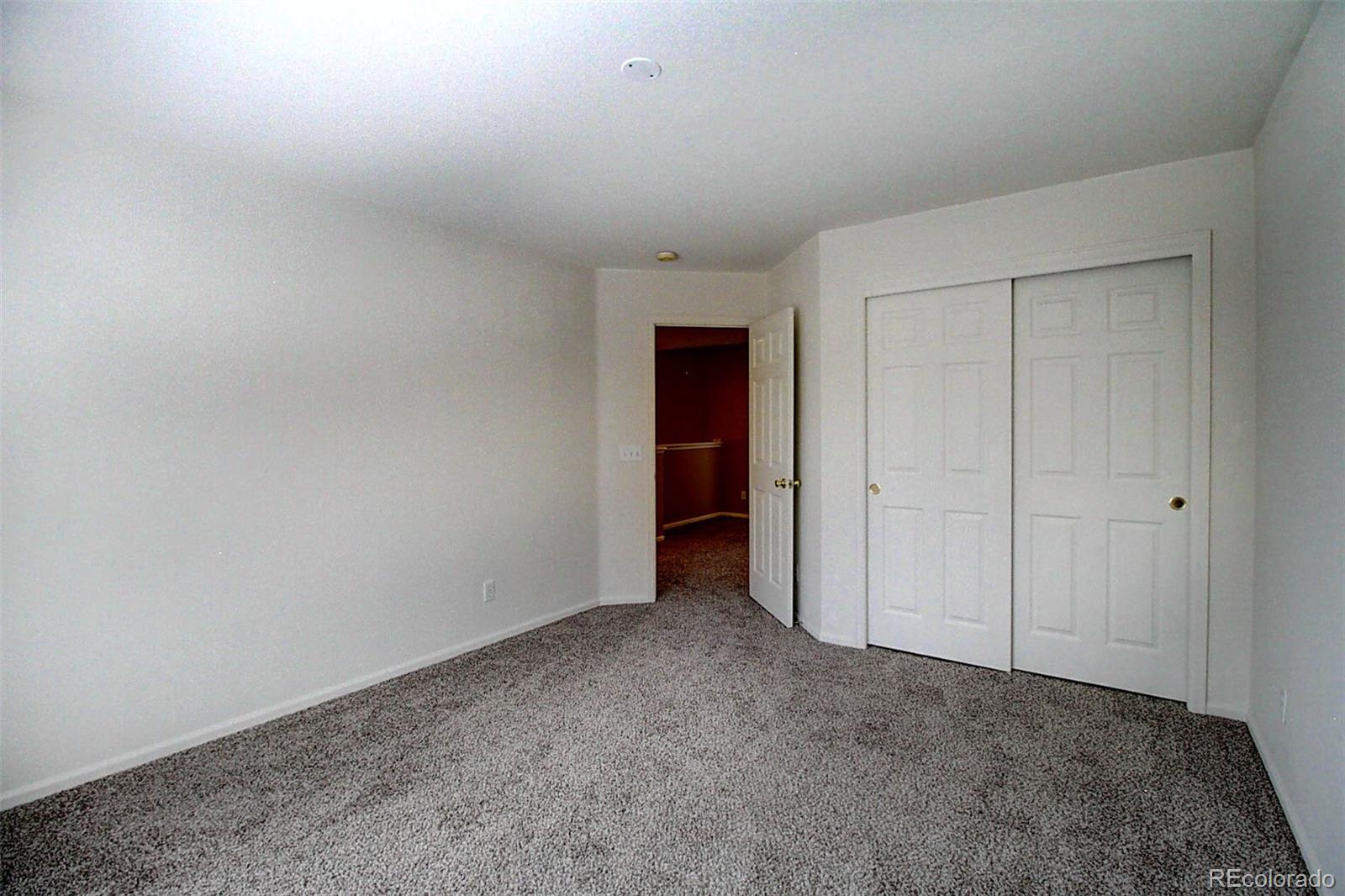 5794 South Rome Street Aurora, CO 80015 - Photo 23 of 37 a view of an empty room and entryway