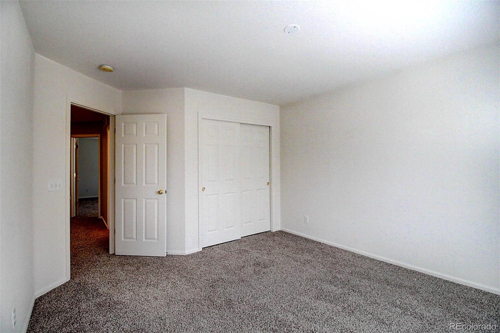 5794 South Rome Street Aurora, CO 80015 - Photo 24 of 37 a view of an empty room and closet area