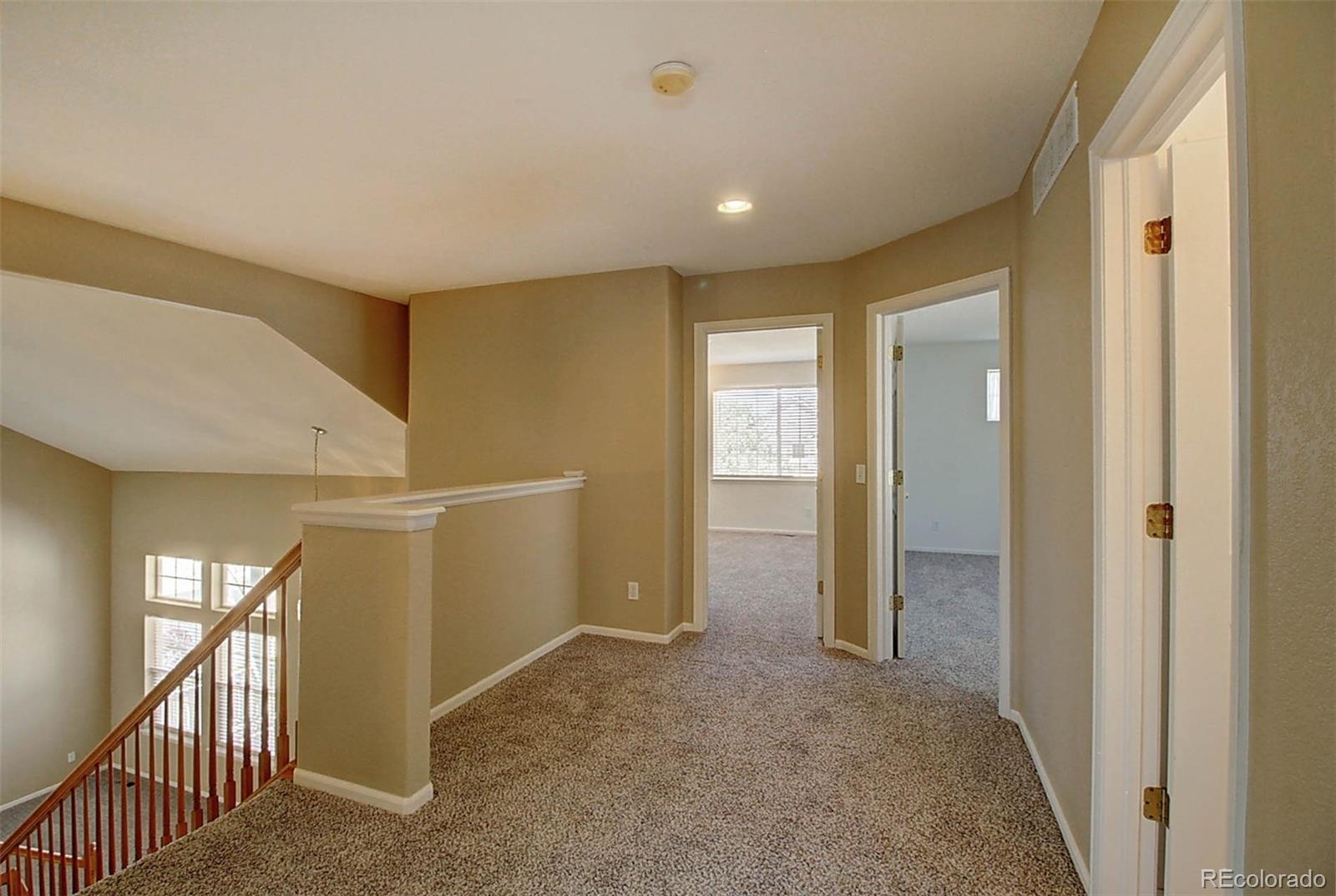 5794 South Rome Street Aurora, CO 80015 - Photo 25 of 37 a view of a hallway with an entryway