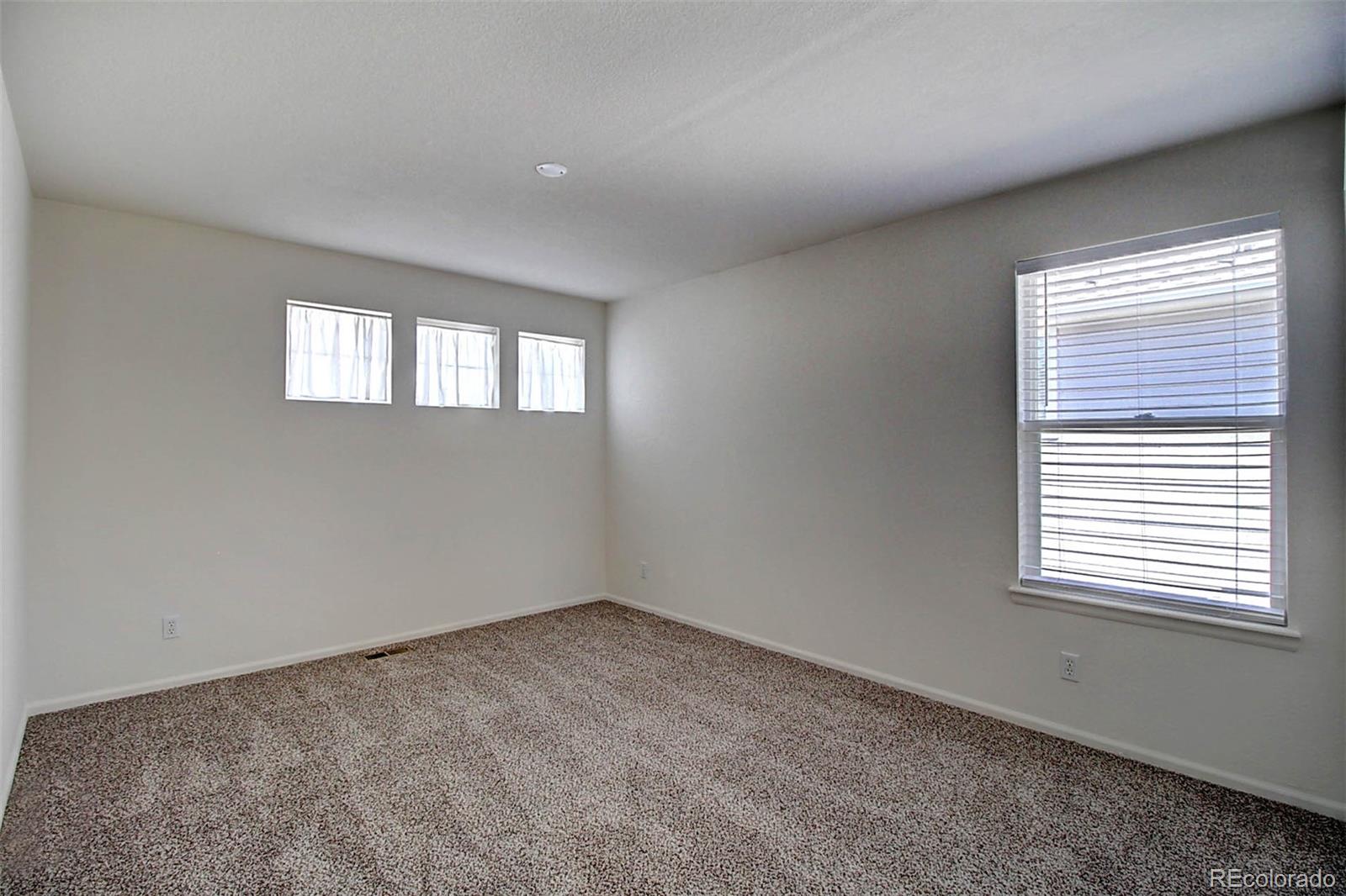 5794 South Rome Street Aurora, CO 80015 - Photo 27 of 37 an empty room with a window