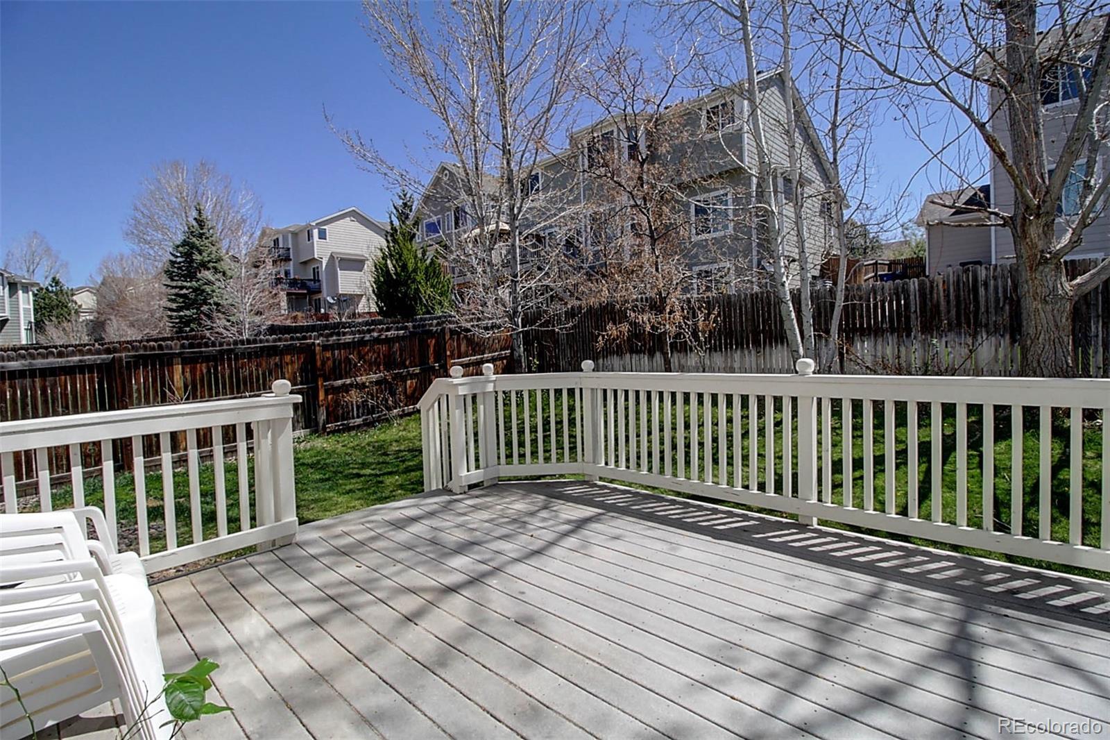 5794 South Rome Street Aurora, CO 80015 - Photo 33 of 37 a view of a wooden roof with trees