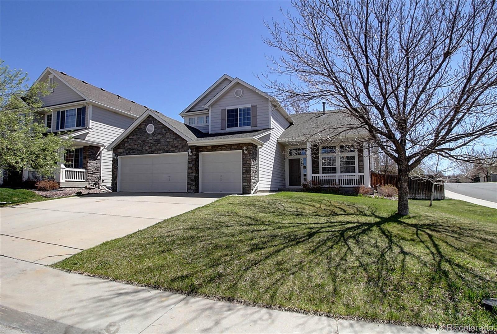 5794 South Rome Street Aurora, CO 80015 - Photo 37 of 37 a front view of a house with a yard and garage
