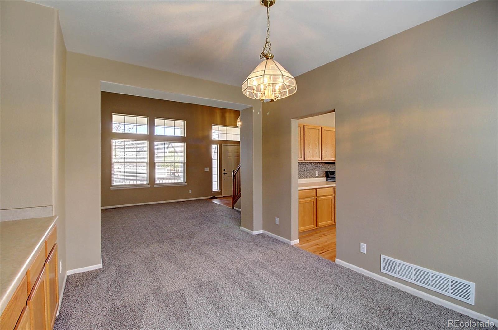 5794 South Rome Street Aurora, CO 80015 - Photo 6 of 37 a view of an empty room with a window
