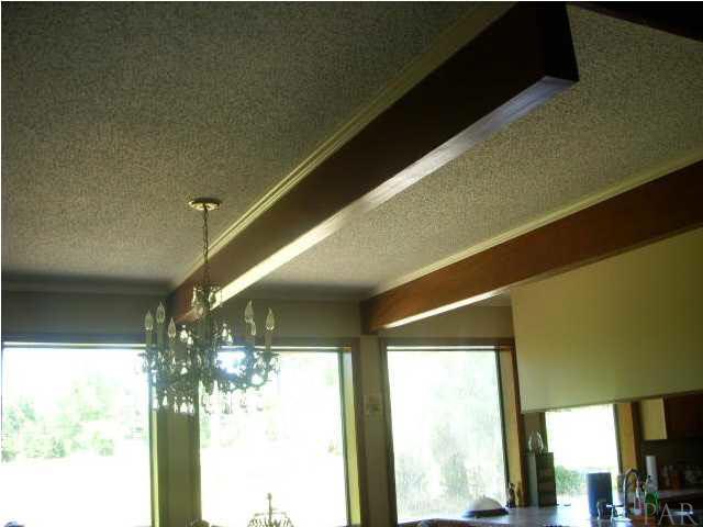 740 Freedom Road Century, FL 32535 - Photo 8 of 19 BEAMS ON CEILING IN DINING AREA