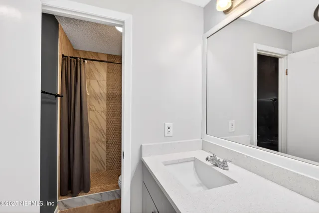 an empty room with wooden floor and closet