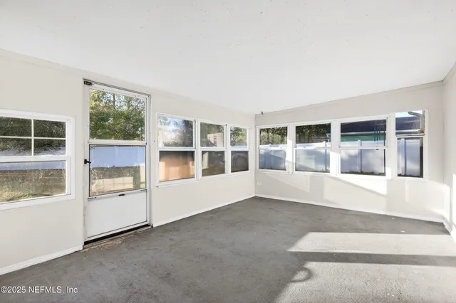 a view of yard with swimming pool and trees