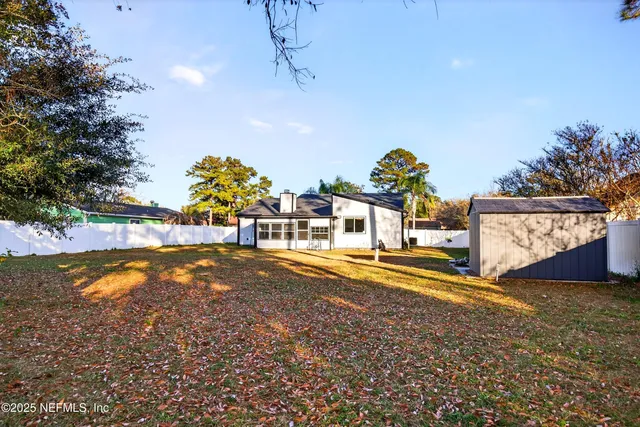 a view of a swimming pool with an outdoor space and seating area