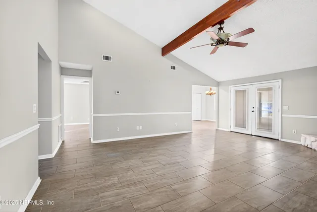 a kitchen with stainless steel appliances a refrigerator sink and cabinets